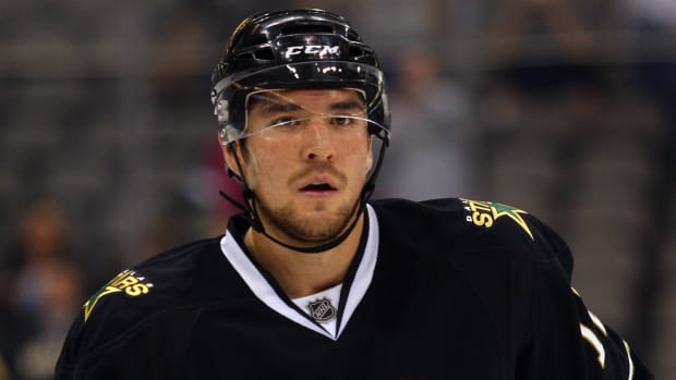 Former Dallas Stars right wing Raymond Sawada 12 skates to the bench.